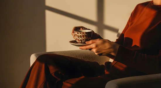2026 QBP General Woman Holding Coffee
