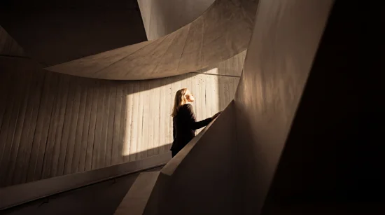 2026 QBP Businessowners Woman Walkingupstairs
